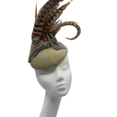 Stunning tweed base headpiece with gorgeous bow detail and a large spray of feathers to finish.